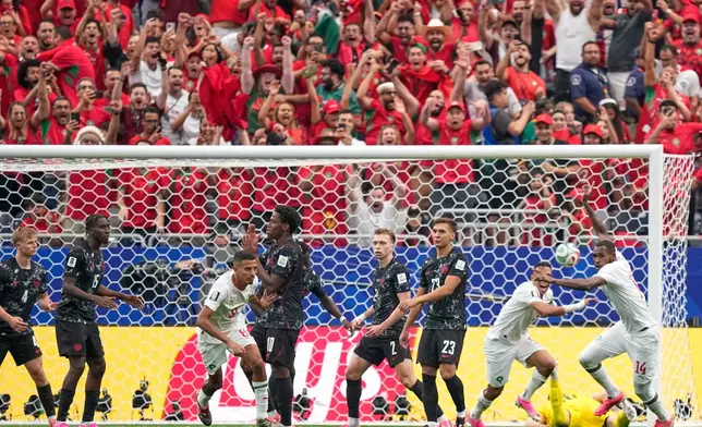 Canadian players react as Morocco's Azzedine Ounahi (8) scores their first goal during the World Cup round of 16 soccer match between Canada and Morocco in Houston, Saturday, July 4, 2026. (AP Photo/Ashley Landis)