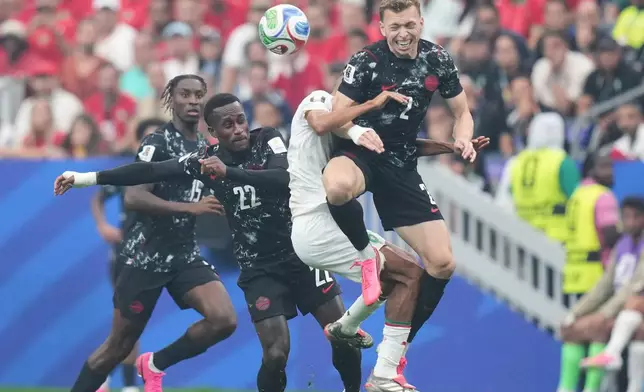 Canada's Alistair Johnston, top, and Morocco's Azzedine Ounahi vie for the ball during the World Cup round of 16 soccer match between Canada and Morocco in Houston, Saturday, July 4, 2026. (AP Photo/Eric Gay)
