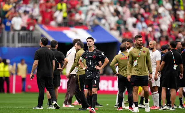 Canada's Stephen Eustaquio (7) stands on the pitch after the World Cup round of 16 soccer match between Canada and Morocco in Houston, Saturday, July 4, 2026. (AP Photo/Ashley Landis)