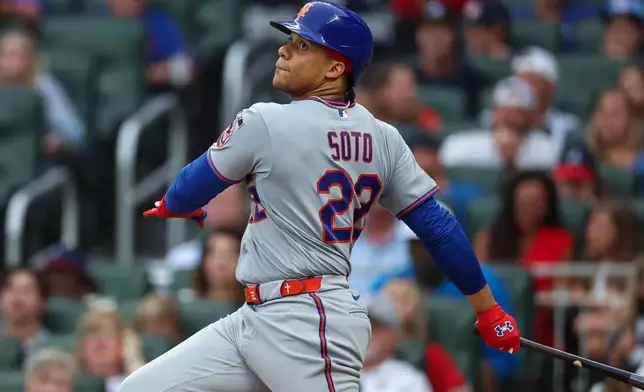 New York Mets' Juan Soto watches his tying two-run home run in the third inning of a baseball game against the Atlanta Braves, Friday, July 3, 2026, in Atlanta. (AP Photo/Colin Hubbard)