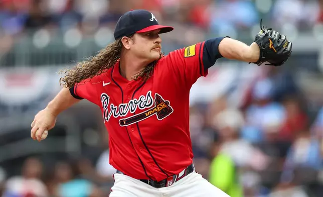 Atlanta Braves pitcher Grant Holmes delivers in the first inning of a baseball game against the New York Mets, Friday, July 3, 2026, in Atlanta. (AP Photo/Colin Hubbard)