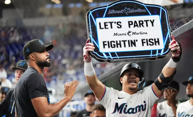 Miami Marlins' Heriberto Hernández celebrates after hitting a solo home run during the first inning of a baseball game against the Philadelphia Phillies, Monday, July 27, 2026, in Miami. (AP Photo/Lynne Sladky)