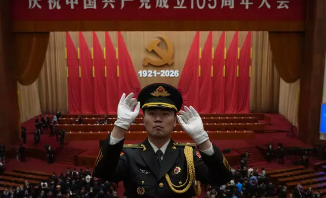 A military band conductor leads during a ceremony to mark the 105th anniversary of the founding of the Chinese Communist Party at the Great Hall of the People in Beijing, Wednesday, July 1, 2026. (AP Photo/Ng Han Guan)