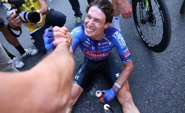 Belgium's Jasper Philipsen reacts after winning the seventeenth stage of the Tour de France cycling race, with start in Chambery and finish in Voiron France, Wednesday, July 22, 2026. (Gonzalo Fuentes/Pool Photo via AP)