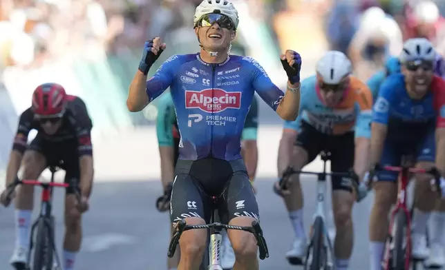 Belgium's Jasper Philipsen crosses the finish line to win the seventeenth stage of the Tour de France cycling race, with start in Chambery and finish in Voiron France, Wednesday, July 22, 2026. (AP Photo/Thibault Camus)