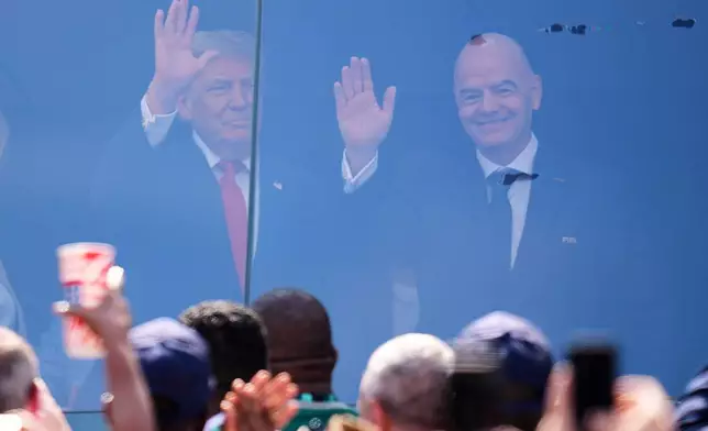 President Donald J. Trump stands with FIFA President Gianni Infantino before the World Cup final soccer match between Spain and Argentina in East Rutherford, N.J., near New York, Sunday, July 19, 2026. (AP Photo/Julio Cortez)