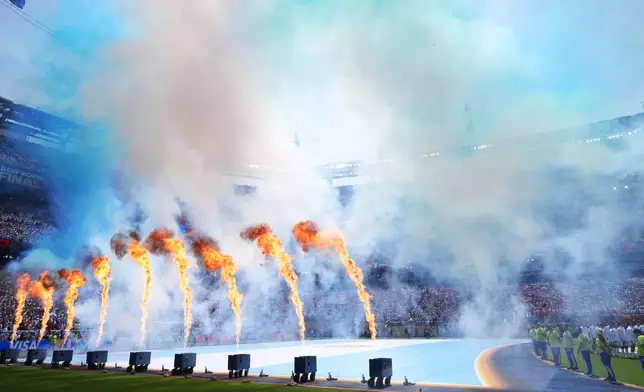 Pyrotechnics fire as players line up during the pregame ceremony before the World Cup championship final soccer match between Spain and Argentina in East Rutherford, N.J., Sunday, July 19, 2026. (AP Photo/Jacquelyn Martin)