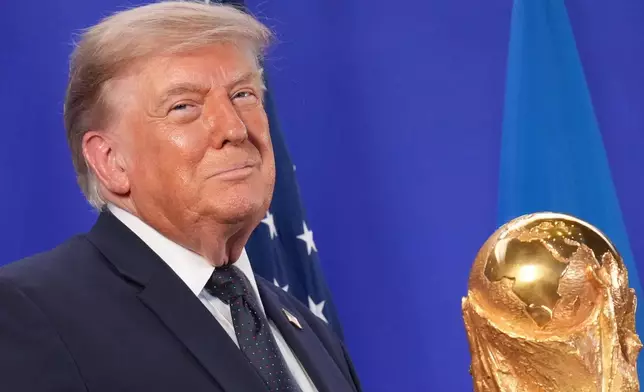 President Donald Trump listens as FIFA President Gianni Infantino speaks at a reception at Trump Tower in New York, Friday, July 17, 2026. (AP Photo/Jacquelyn Martin)