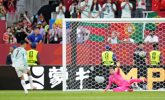 Portugal's Cristiano Ronaldo (7) scores on a penalty kick past Croatia goalkeeper Dominik Livakovic (1) during the World Cup round of 32 soccer match between Portugal and Croatia in Toronto, Thursday, July 2, 2026. (Nathan Denette/The Canadian Press via AP)