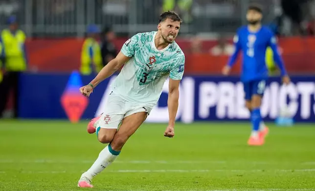 Portugal's Ruben Dias (3) celebrates a win during the World Cup round of 32 soccer match between Portugal and Croatia in Toronto, Thursday, July 2, 2026. (AP Photo/Mike Stewart)