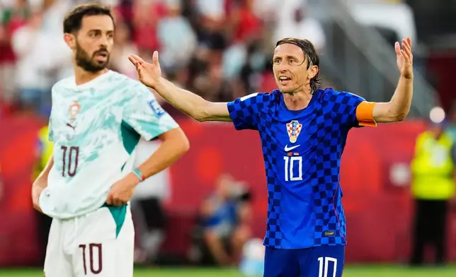 Croatia's Luka Modric (10) reacts to a call as Portugal's Bernardo Silva (10) looks on during the World Cup round of 32 soccer match between Portugal and Croatia in Toronto, Thursday, July 2, 2026. (Chris Young/The Canadian Press via AP)