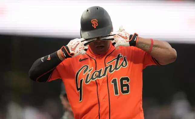 San Francisco Giants' Rafael Devers gestures after hitting a home run during the second inning of a baseball game against the Colorado Rockies, Friday, July 10, 2026, in San Francisco. (AP Photo/Jeff Chiu)