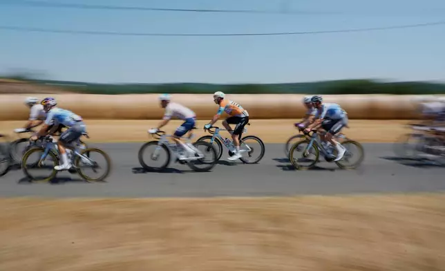 The pack rides during the fifth stage of the Tour de France cycling race over 158.3 kilometers (98.1 miles) with start in Lannemezan and finish in Pau, France, Wednesday, July 8, 2026. (AP Photo/Mosa'ab Elshamy)