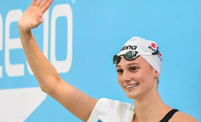 Summer McIntosh waves to fans after setting a new world in the women's 200m butterfly final at the Canadian Swimming Trials in Montreal, on Sunday, July 5, 2026. (Graham Hughes/The Canadian Press via AP)