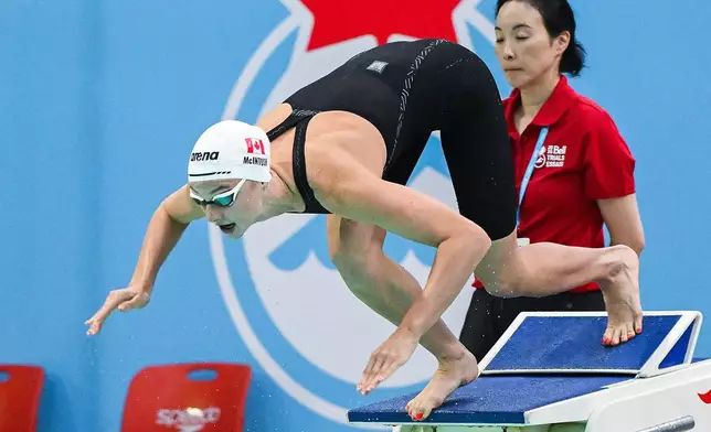 Summer McIntosh dives off the blocks at the start of the women's 200m butterfly final at the Canadian Swimming Trials in Montreal, on Sunday, July 5, 2026. (Graham Hughes/The Canadian Press via AP)