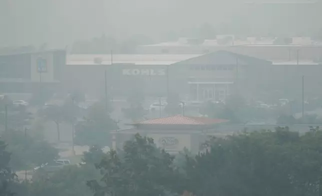 A general view of street mall during poor air quality due to dense smoke from Canadian wildfires in Glenview, Ill., Thursday, July 16, 2026. (AP Photo/Nam Y. Huh) CORRECTION: Glenview, not Northbrook