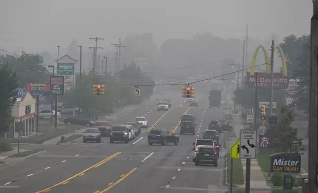 Wildfire smoke blankets downtown Jackson, Mich., Thursday, July 16, 2026. (J. Scott Park/Jackson Citizen Patriot via AP)