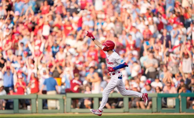 Philadelphia Phillies' Trea Turner reacts after hitting a three-run home run against Pittsburgh Pirates pitcher Paul Skenes during the second inning of a baseball game Wednesday, July 1, 2026, in Philadelphia. (AP Photo/Matt Slocum)