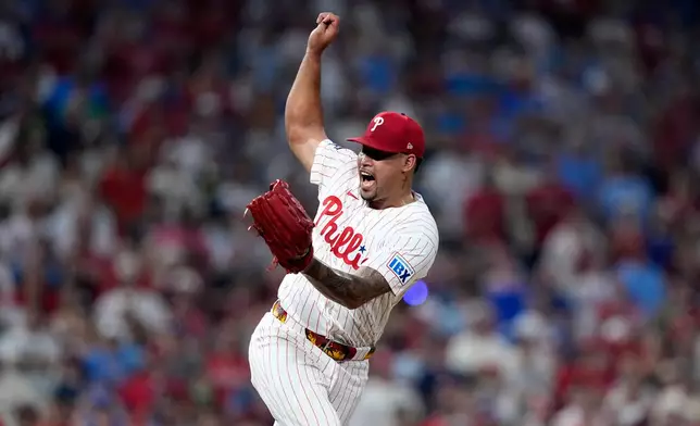 Philadelphia Phillies' Jhoan Duran reacts after the Phillies won a baseball game against the Pittsburgh Pirates Wednesday, July 1, 2026, in Philadelphia. (AP Photo/Matt Slocum)