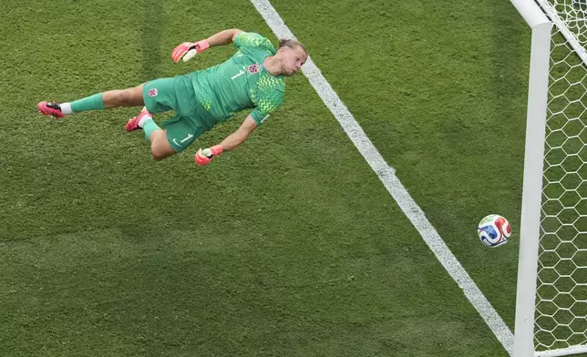 Norway goalkeeper Oerjan Nyland (1) looks back as he dives for the ball during the World Cup round of 16 soccer match between Brazil and Norway in East Rutherford, N.J., near New York, Sunday, July 5, 2026. (AP Photo/Matt Slocum)