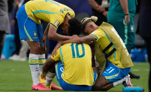 Brazil's Marquinhos, left, Neymar (10) and Raphinha react after losing to Norway the World Cup round of 16 soccer match between Brazil and Norway in East Rutherford, N.J., near New York, Sunday, July 5, 2026. (AP Photo/Seth Wenig)