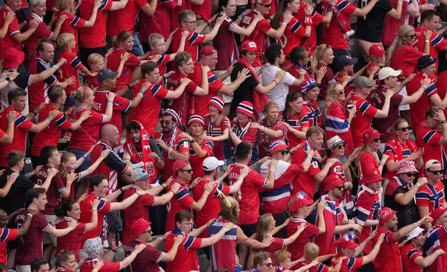 Norway supporters dance in the stands during the World Cup round of 16 soccer match between Brazil and Norway in East Rutherford, N.J., near New York, Sunday, July 5, 2026. (AP Photo/Matt Slocum)