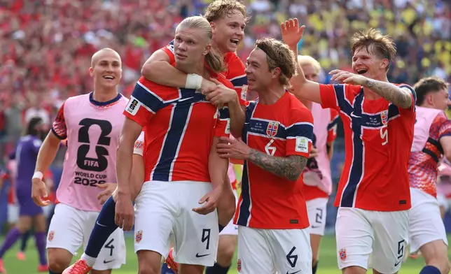 Norway's Erling Haaland (9) celebrates with teammates after scoring their second goal during the World Cup round of 16 soccer match between Brazil and Norway in East Rutherford, N.J., near New York, Sunday, July 5, 2026. (AP Photo/Pamela Smith)