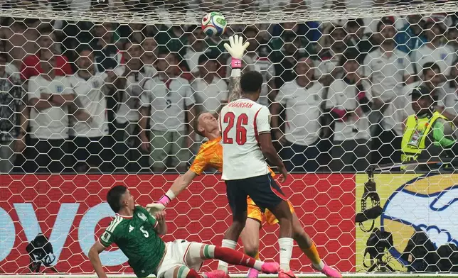 England goalkeeper Jordan Pickford fails to stop a goal by Mexico's Julian Quinones during the World Cup round of 16 soccer match between Mexico and England in Mexico City, Sunday, July 5, 2026. (AP Photo/Silvia Izquierdo)