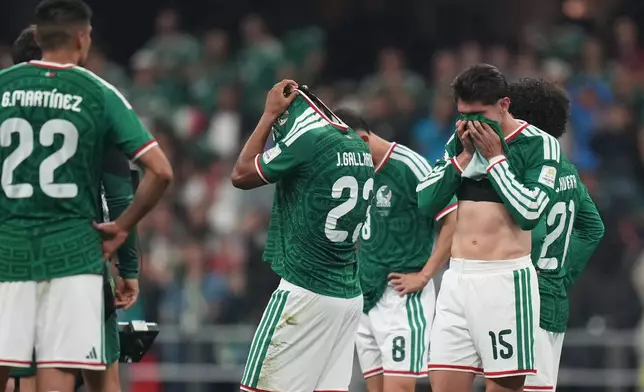 Mexico players react at the the end of the World Cup round of 16 soccer match between Mexico and England in Mexico City, Sunday, July 5, 2026. (AP Photo/Silvia Izquierdo)