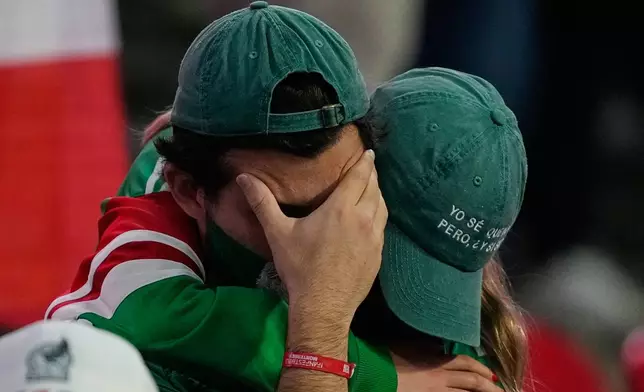 Mexico fans react following the World Cup round of 16 soccer match between Mexico and England in Mexico City, Sunday, July 5, 2026. (AP Photo/Natacha Pisarenko)