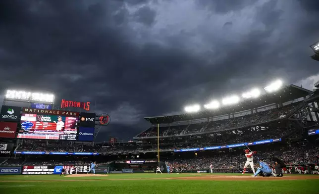 Toronto Blue Jays pitcher Shane Bieber, left, throws to Washington Nationals' Jorbit Vivas, right, during the first inning of a baseball game, Tuesday, July 28, 2026, in Washington. (AP Photo/Nick Wass)