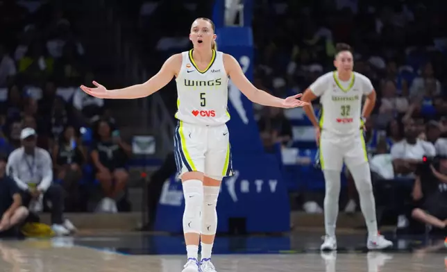 Dallas Wings guard Paige Bueckers questions a call during the first half of a WNBA basketball game against the Atlanta Dream in Arlington, Texas, Wednesday, July 29, 2026. (AP Photo/LM Otero)