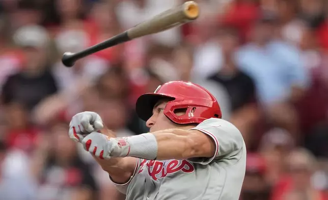 Philadelphia Phillies J.T. Realmuto loses control of his bat during the fourth inning of a baseball game against the Cincinnati Reds in Cincinnati, Wednesday, July 8, 2026. (AP Photo/Carolyn Kaster)