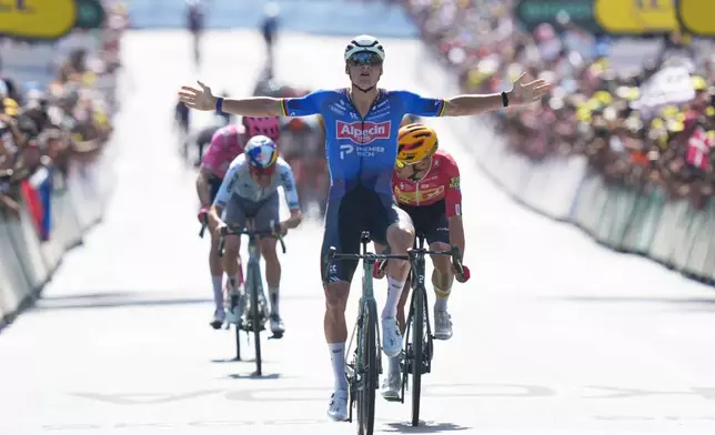 Netherland's Mathieu van der Poel crosses the finish line to win the ninth stage of the Tour de France cycling race with start in Malemort and finish in Ussel, France, Sunday, July 12, 2026. (AP Photo/Thibault Camus)
