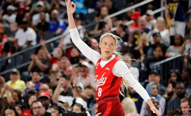 Indiana Fever guard Sophie Cunningham (8) reacts after making a basket against the Las Vegas Aces during the first half of an WNBA basketball game Sunday, July 5, 2026, in Las Vegas. (Steve Marcus/Las Vegas Sun via AP)