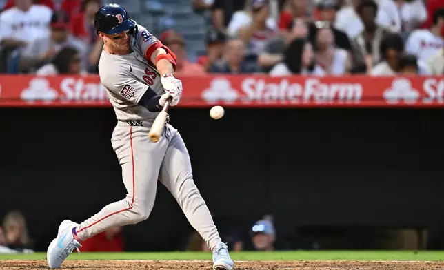 Boston Red Sox's Romy Gonzalez hits a two-run home run during the fifth inning of a baseball game against the Los Angeles Angels, Saturday, July 4, 2026, in Anaheim, Calif. (AP Photo/William Liang)