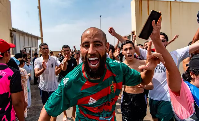 Migrants cross from Morocco into the Spanish enclave of Ceuta, Thursday, July 30, 2026. (AP Photo/Antonio Sempere)