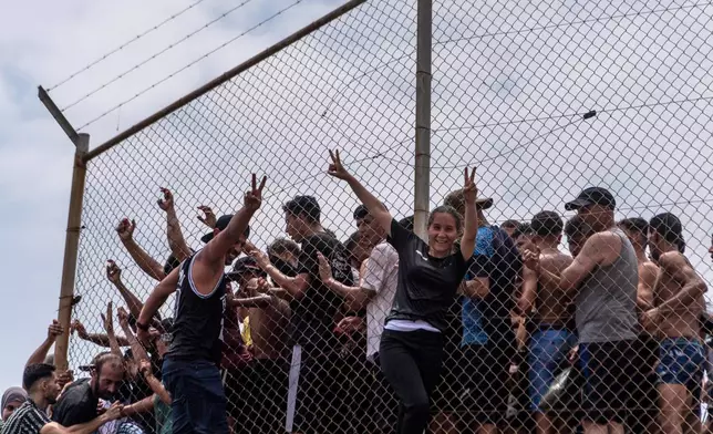 Migrants cross from Morocco into the Spanish enclave of Ceuta, Thursday, July 30, 2026. (AP Photo/Antonio Sempere)