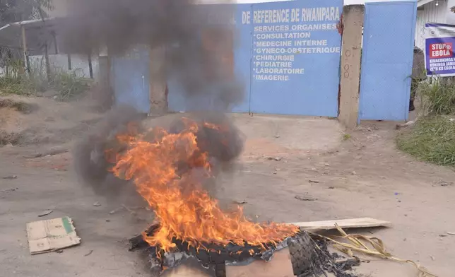 Workers at an Ebola treatment center go on strike over unpaid salaries and bonuses at Rwampara General Hospital, in Ituri, northeastern Congo, Monday, July 13, 2026, (AP Photo/Dirole Lotsima Dieudonne)