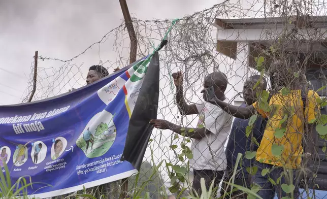 Workers at an Ebola treatment center go on strike over unpaid salaries and bonuses at Rwampara General Hospital, in Ituri, northeastern Congo, Monday, July 13, 2026, (AP Photo/Dirole Lotsima Dieudonne)