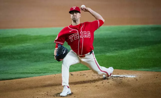 Texas Rangers' MacKenzie Gore (1) pitches during the first inning of a baseball game against the Mariners, Friday, July 24, 2026, Arlington, Texas. (AP Photo/Jessica Tobias)