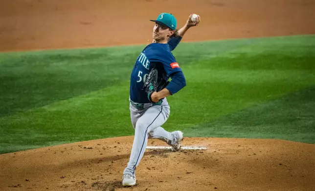 Seattle Mariners' Bryce Miller pitches during the first inning of a baseball game against the Texas Rangers, Friday, July 24, 2026, Arlington, Texas. (AP Photo/Jessica Tobias)