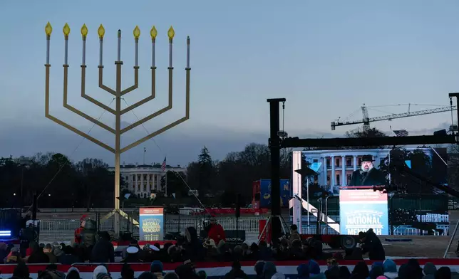 FILE - Rabbi Levi Shemtov speaks to the crowd before he lights the Menorah during the annual National Menorah Lighting in celebration of Hanukkah, on the Ellipse near the White House in Washington, Dec. 14, 2025. (AP Photo/Jose Luis Magana, File)