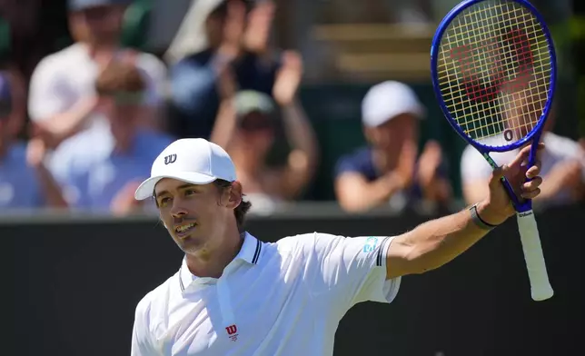 Alex de Minaur of Australia celebrates winning the second round men's singles match against Adrian Mannarino of France at the Wimbledon Tennis Championships in London, Thursday, July 2, 2026.(AP Photo/Kin Cheung)