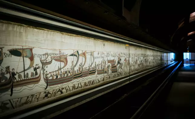 FILE - This photo taken Sept. 18, 2019 shows the 11th century Bayeux tapestry chronicling the Norman conquest of England, in Bayeux, Normandy, France. (AP Photo/Kamil Zihnioglu, File)