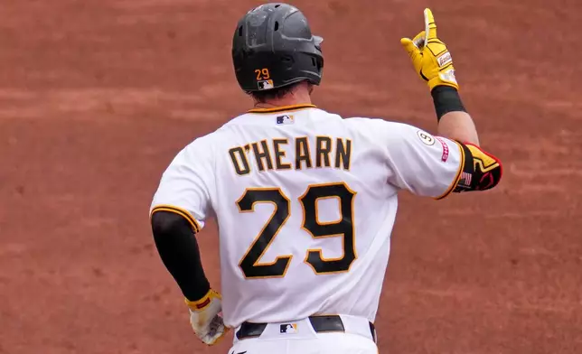 Pittsburgh Pirates' Ryan O'Hearn rounds the bases after hitting a grand slam off Chicago Cubs pitcher Jameson Taillon during the third inning of a baseball game in Pittsburgh, Sunday, July 26, 2026. (AP Photo/Gene J. Puskar)