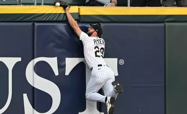 Chicago White Sox center fielder Tristan Peters misses a two-run double hit by New York Yankees' Anthony Volpe during the second inning of a baseball game in Chicago, Tuesday, July 28, 2026. (AP Photo/Paul Beaty)