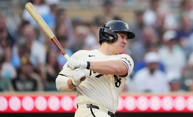 Minnesota Twins' Alan Roden hits a two-run single during the sixth inning of a baseball game against the Athletics, Saturday, July 25, 2026, in Minneapolis. (AP Photo/Ellen Schmidt)