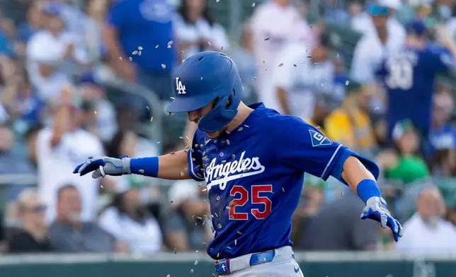Los Angeles Dodgers' Tommy Edman celebrates after hitting a three-run home run during the third inning of a baseball game against the Athletics Tuesday, June 30, 2026, in West Sacramento, Calif. (AP Photo/Sara Nevis)