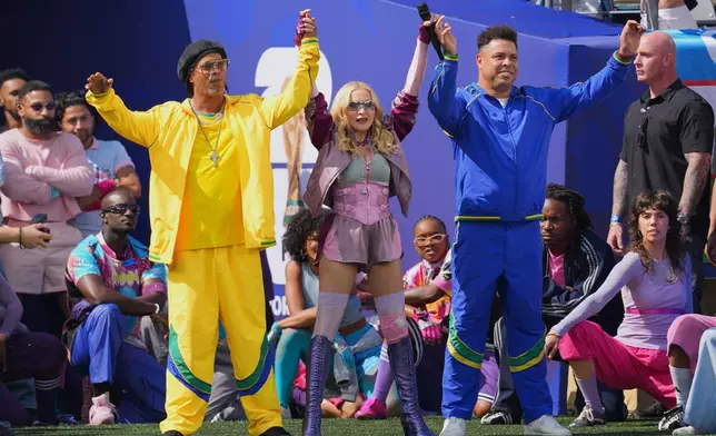 Ronaldinho and Ronaldo perform with Madonna during the halftime show in the World Cup final soccer match between Spain and Argentina in East Rutherford, N.J., near New York, Sunday, July 19, 2026. (AP Photo/Julio Cortez)
